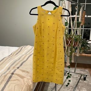 Vintage Yellow Dress with Gold Star Burst Design